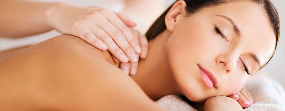 a beautiful woman getting a back massage